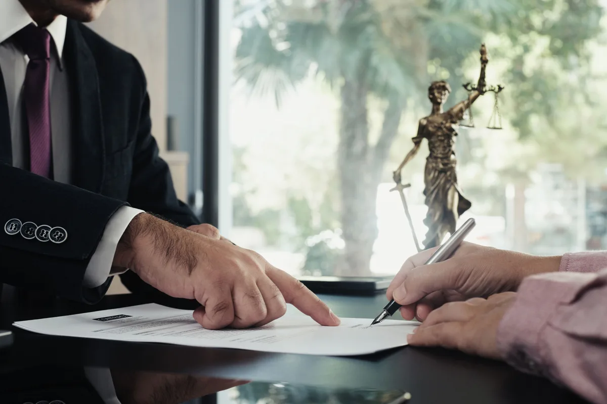 Legal document signing with Lady Justice — Houston notary public